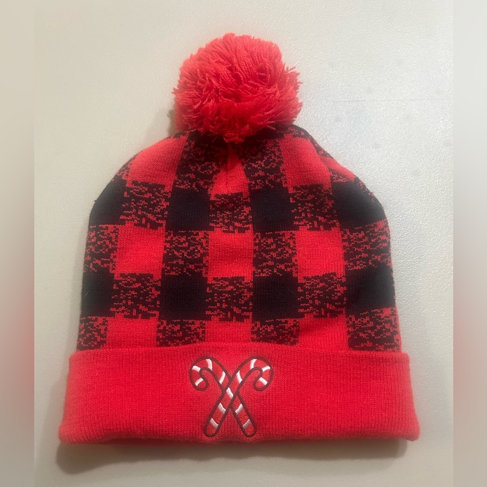 Red and Black Plaid Beanie with Candy Cane Design. New without tag.